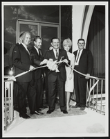 E. Parry Thomas, Howard Cannon, and unidentified people in a ribbon cutting ceremony: photographic print