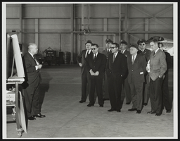Paul Bible, Chief, National Aeronautics and Space Administration Flight Research Center, briefs the visiting senatorial committee on the X-15 manned research rocket plane: photographic print