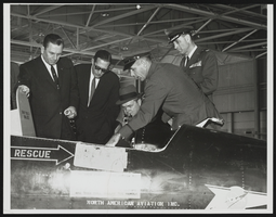 Major Robert M. White explains X-15 cockpit arrangement: photographic print
