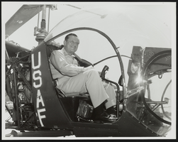 Howard Cannon sitting in the cockpit of a helicopter at Edwards Air Force Base, California: photographic print
