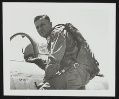 Howard Cannon climbing out of an aircraft at Nellis Air Force Base, Nevada: photographic print