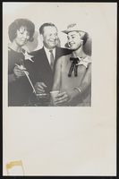 Howard Cannon with two unidentified women wearing "Cannonette" badges: photographic print