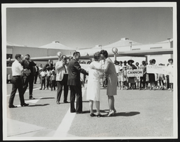 Howard and Dorothy Cannon greeted upon arriving at a press event: photographic print