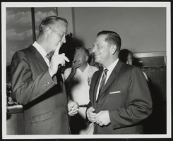 Howard Cannon speaking with an unidentified man: photographic print