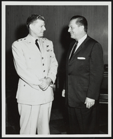 Howard Cannon speaking with an unidentified man: photographic print