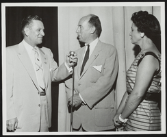Howard Cannon speaking with two unidentified people at an event: photographic print