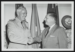 Howard Cannon shaking hands with a United States Air Force personnel: photographic print