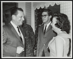 Howard Cannon speaking with unidentified people: photographic print