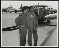 Howard Cannon on an airfield speaking to a F-104 Starfighter pilot: photographic print