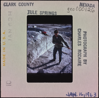 Photographic slide of a person shoveling at Tule Springs, Nevada, January 16, 1963