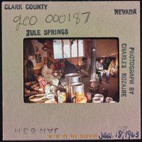 Photographic slide of people eating at a Tule Springs, Nevada campsite, January 18, 1963