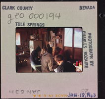 Photographic slide of people inside a cook shack at Tule Springs, Nevada, January 18, 1963