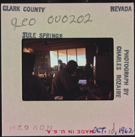 Photographic slide of people in a cook shack at Tule Springs, Nevada, October 10, 1962