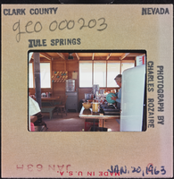 Photographic slide of a person inside a cook shack at Tule Springs, Nevada, January 20, 1963