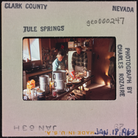 Photographic slide of people in a cook shack at Tule Springs, Nevada, January 18, 1963