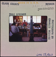 Photographic slide of people in a cook shack at Tule Springs, Nevada, January 15, 1963