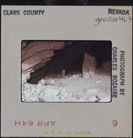 Photographic slide of men surveying a cave in Clark County, Nevada, circa 1963-1964
