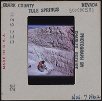 Photographic slide of a man at Tule Springs, Nevada, November 7, 1962