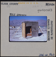 Photographic slide of camp site storage at Tule Springs, Nevada, January 28, 1963