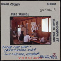 Photographic slide of people in the cook shack, Tule Springs, Nevada, January 27, 1963