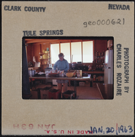 Photographic slide of a person in a cook shack, Tule Springs, Nevada, January 20, 1963