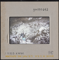 Photographic slide of a group of people at a rocky area at Tule Springs, Nevada, circa 1960s