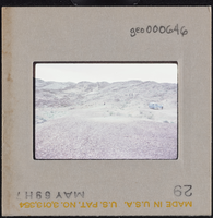 Photographic slide of a group of people at a rocky landscape at Tule Springs, Nevada, circa 1960s