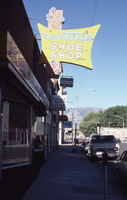 Nenette's Shoe Shop fascia and flag mount signs, Ely, Nevada: photographic print