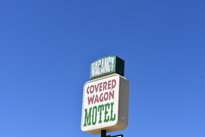 Covered Wagon Motel mounted sign, Jackpot, Nevada