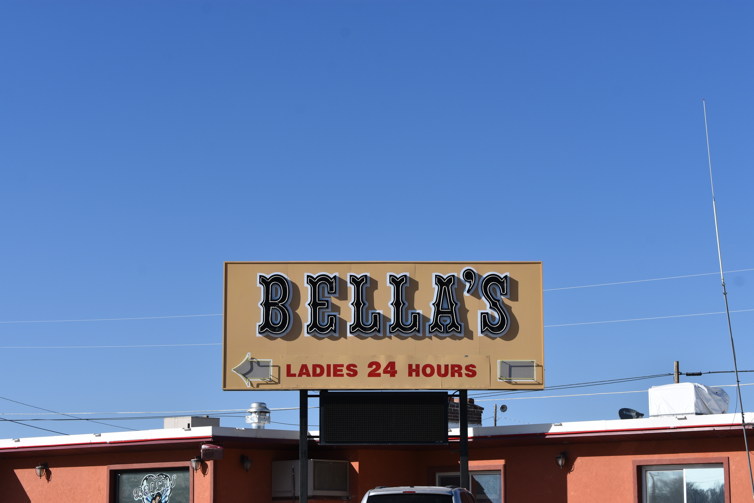 Bella's Hacienda double mounted sign, Wells, Nevada