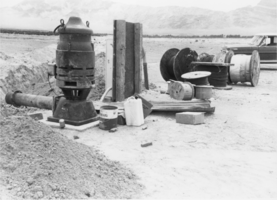Ditch leading to an overhead pivot sprinkler system on the property of Hank Records, Amargosa Valley, Nevada: photographic print