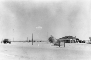 Death Valley Junction with a mushroom cloud due to atomic testing nearby: photographic print