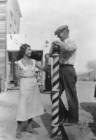 Chloe Lisle talking to Red Mills in front of the barber shop on Main Street, Beatty, Nevada: photographic print