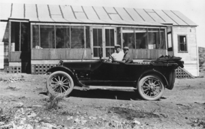 Josiah Irving Crowell and his teenage son, J. Irving Crowell, Jr., in a 1917 Buick: photographic print