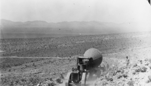 Truck hauling part of a ball mill of the Gold Ace Mill near Beatty, Nevada: photographic print
