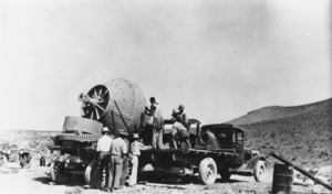 Workers unloading a ball mill near Beatty, Nevada: photographic print