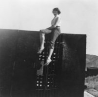 Claudia Davies Reidhead atop the burned-out jail cell: photographic print