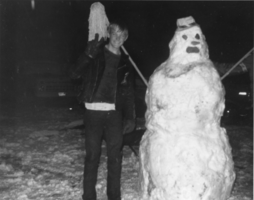 Robin Ruud stands beside a snowman he and his friend Brian King made: photographic print