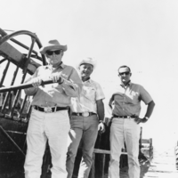 Max Hafen, Bob Ruud, and Tim Hafen celebrate the completion of a cattle chute: photographic print