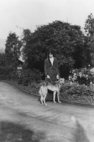 Lois Kellogg at an unknown location with a Russian wolfhound dog: photographic print