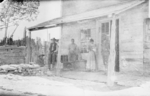 Unidentified individuals in front of the Pahrump Store in Nevada: photographic print