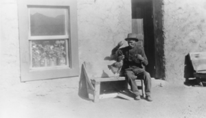 Giovanni Fallini in front of his home at Eden Creek, Nevada: photographic print