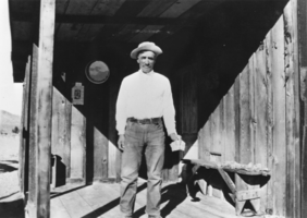 Bautista Venner on the front porch of his home at the base of the Kawich Mountains, Nevada: photographic print