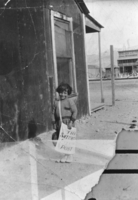 Young Albert Bradshaw selling Saturday Evening Posts at Luning, Nevada: photographic print