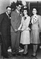 Louis Cirac, Jr., Romano Andreotti, Helen Redmond, and Jeanne Cirac Potts (identified from left to right) during Christmas: photographic print