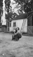 Jean Carver pictured with son Dick in front of the old ranch house on the Carver Ranch, Nevada: photographic print
