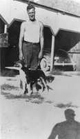 Norman Hanson and his dog Brucite, Basic Magnesium's camp: photographic print
