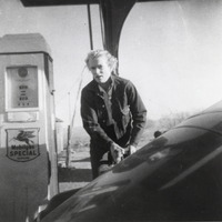 Jean Carver Duhme pumping gas at Carver's Station: photographic print