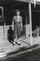 Jean Carver Duhme standing in front of Carver's Station: photographic print