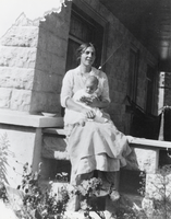 Lillian Yeager Berg with her firstborn Dan on the front porch of her home: photographic print